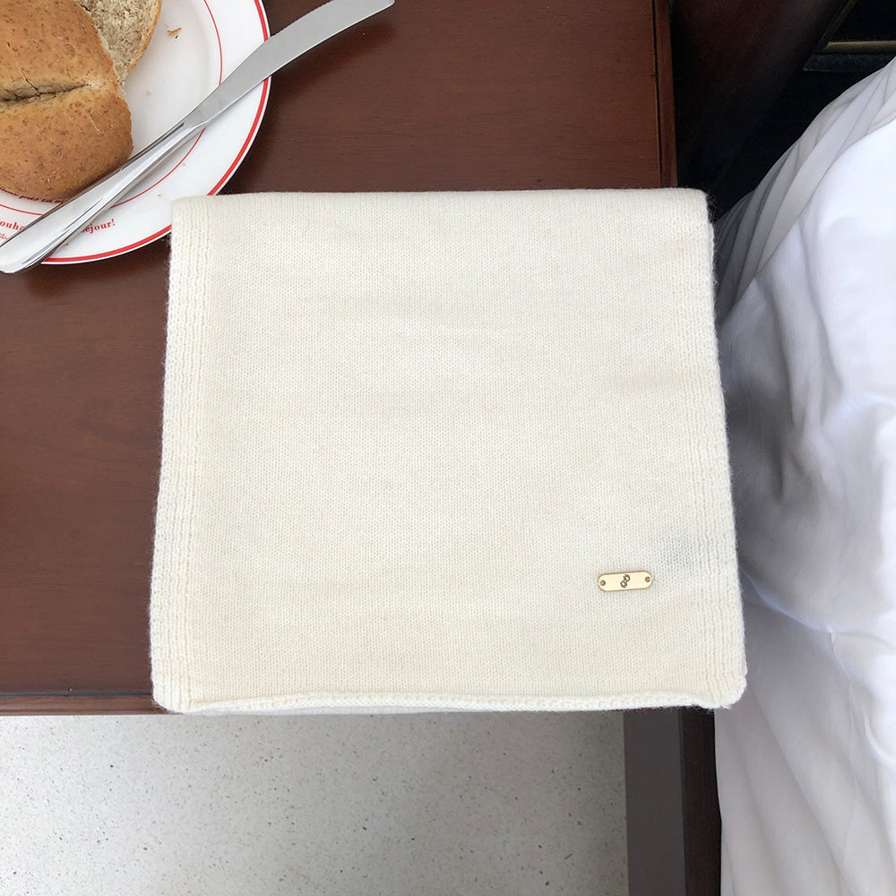 Wärmender Schal aus Merinowolle