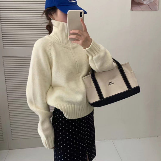 Moderner Strickpullover mit Stehkragen und Reißverschluss