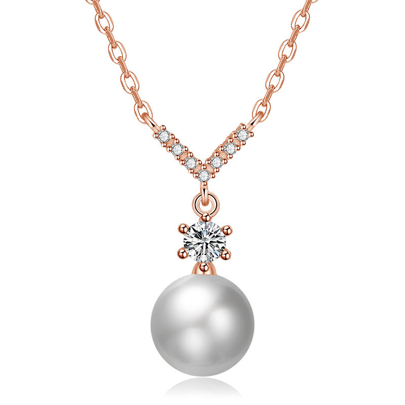 Damen Halskette mit funkelndem Zirkonia-Anhänger und eleganter Perle Shop Nory