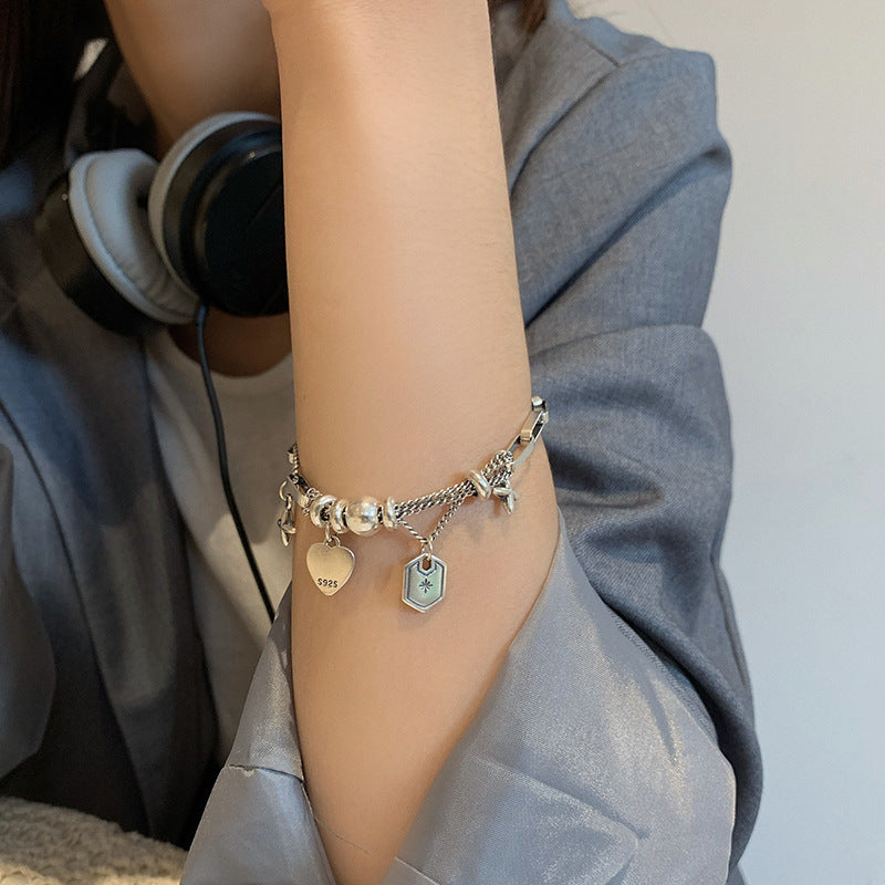 Damen Charm-Armband mit stilvollen Anhängern und hochwertigen Materialien Shop Nory
