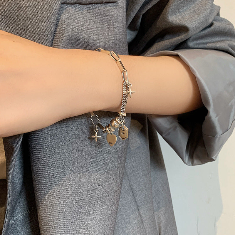 Damen Charm-Armband mit stilvollen Anhängern und hochwertigen Materialien Shop Nory