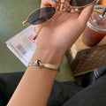 Damen Armreif mit modernem Knoten-Design Shop Nory