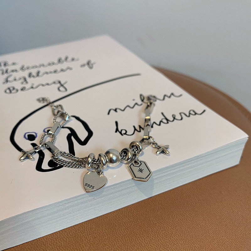 Damen Charm-Armband mit stilvollen Anhängern und hochwertigen Materialien Shop Nory