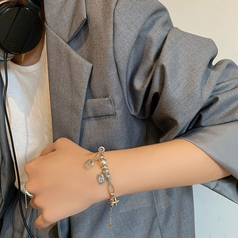 Damen Charm-Armband mit stilvollen Anhängern und hochwertigen Materialien Shop Nory