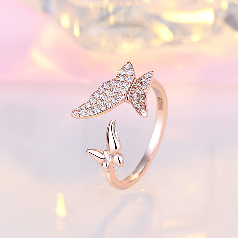 Damen Offener Ring mit filigranem Schmetterlingsdesign und funkelndem Zirkonia Shop Nory