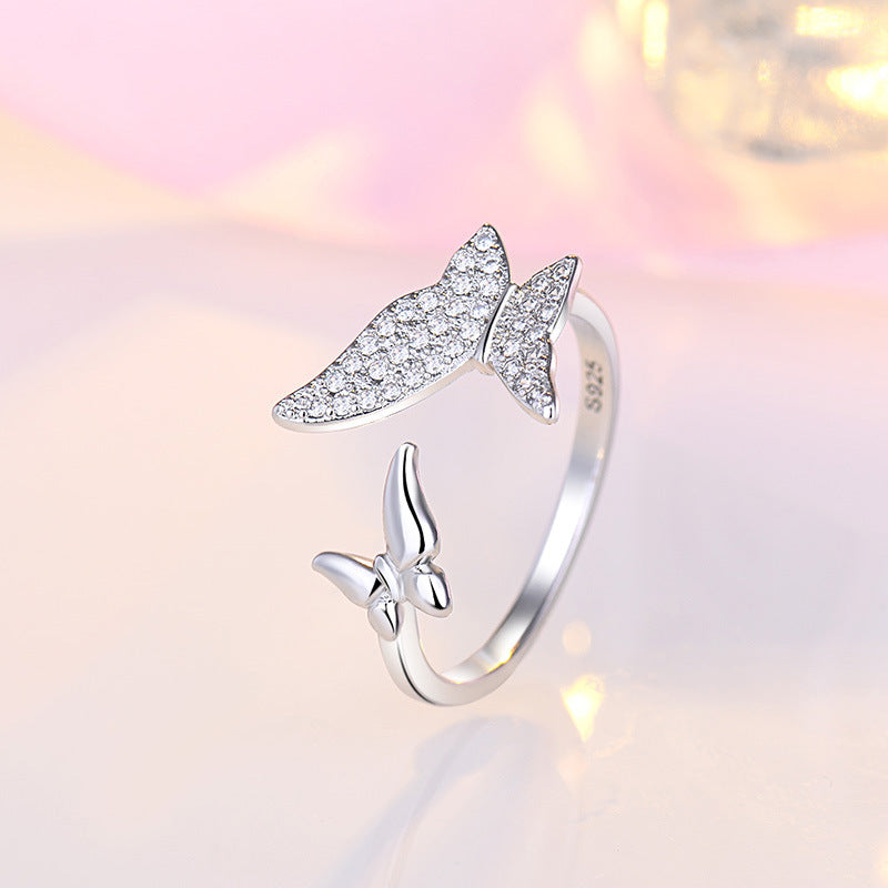 Damen Offener Ring mit filigranem Schmetterlingsdesign und funkelndem Zirkonia Shop Nory