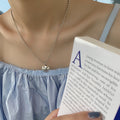 Damen Halskette mit Smiley-Anhänger und eleganter Perlenkette Shop Nory
