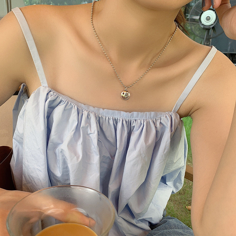 Damen Halskette mit Smiley-Anhänger und eleganter Perlenkette Shop Nory