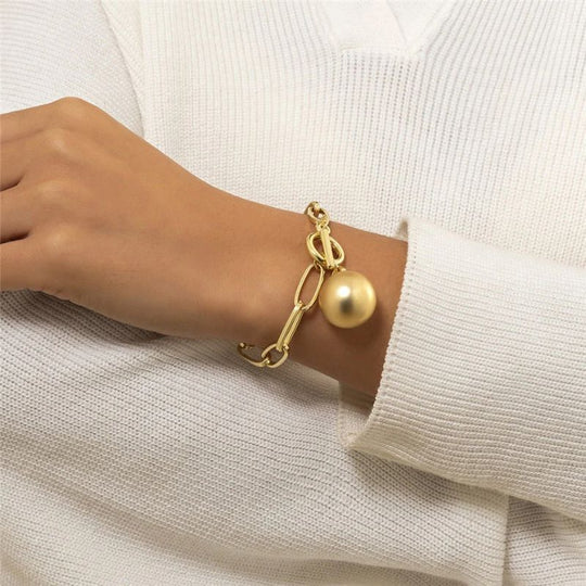 Damen Gliederarmband mit Kugelanhänger in Goldoptik | Shop Nory
