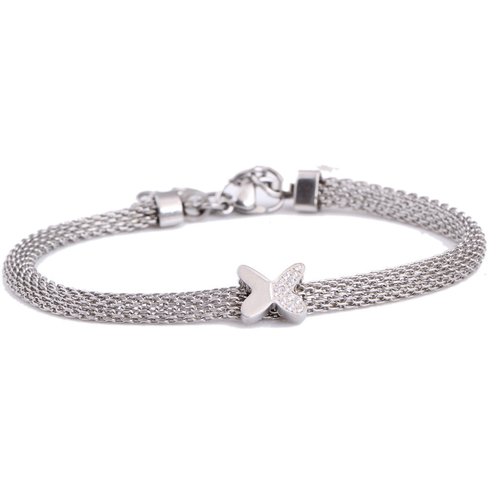 Damen Armband mit filigranem Schmetterlingsanhänger und eleganter Kettenstruktur Shop Nory