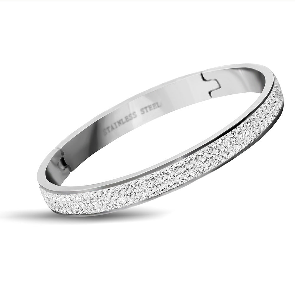 Damen Armband mit funkelndem Kristallbesatz und eleganter Edelstahl-Oberfläche Shop Nory