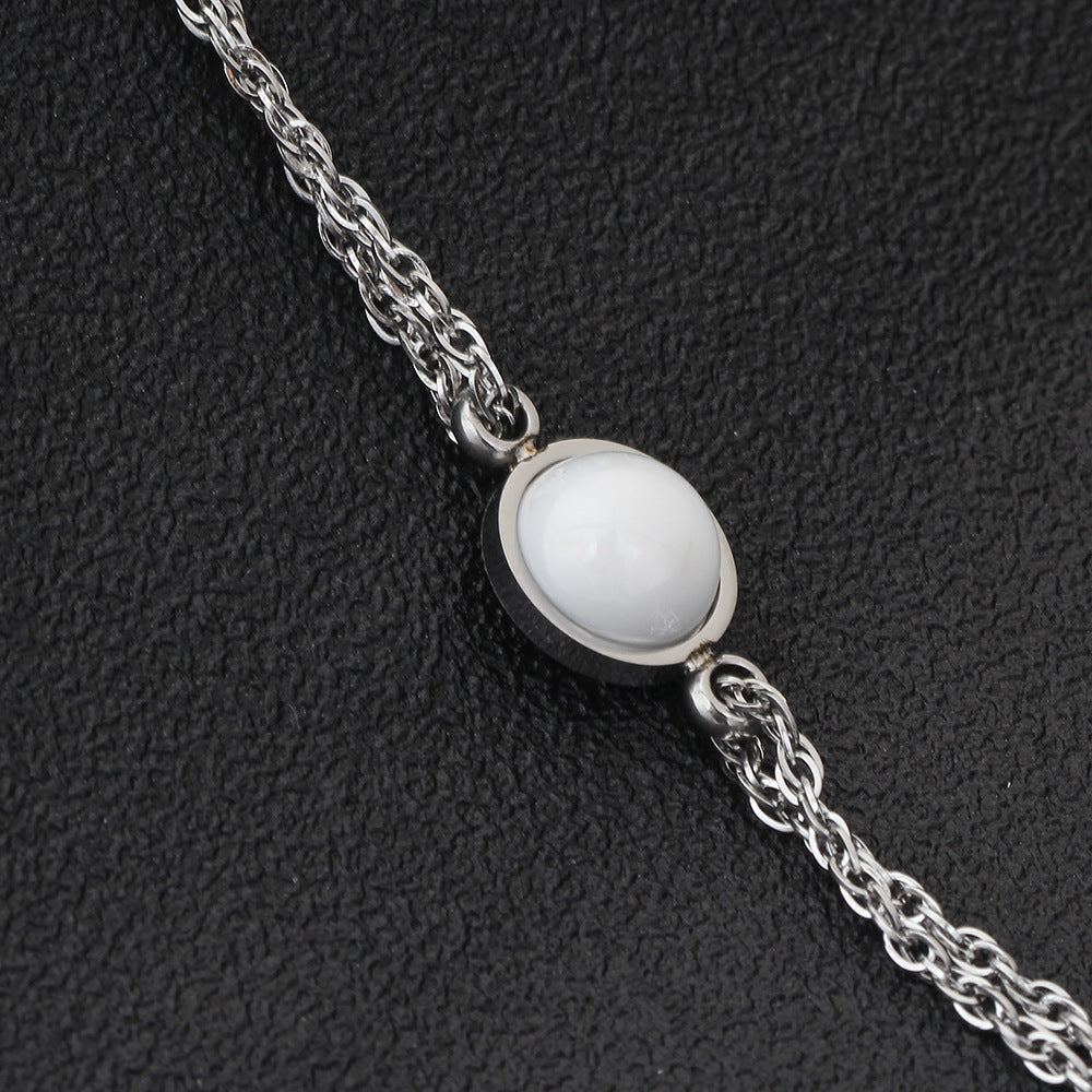 Damen Armband mit funkelndem Zirkonia und hochwertiger Edelstahlkette Shop Nory