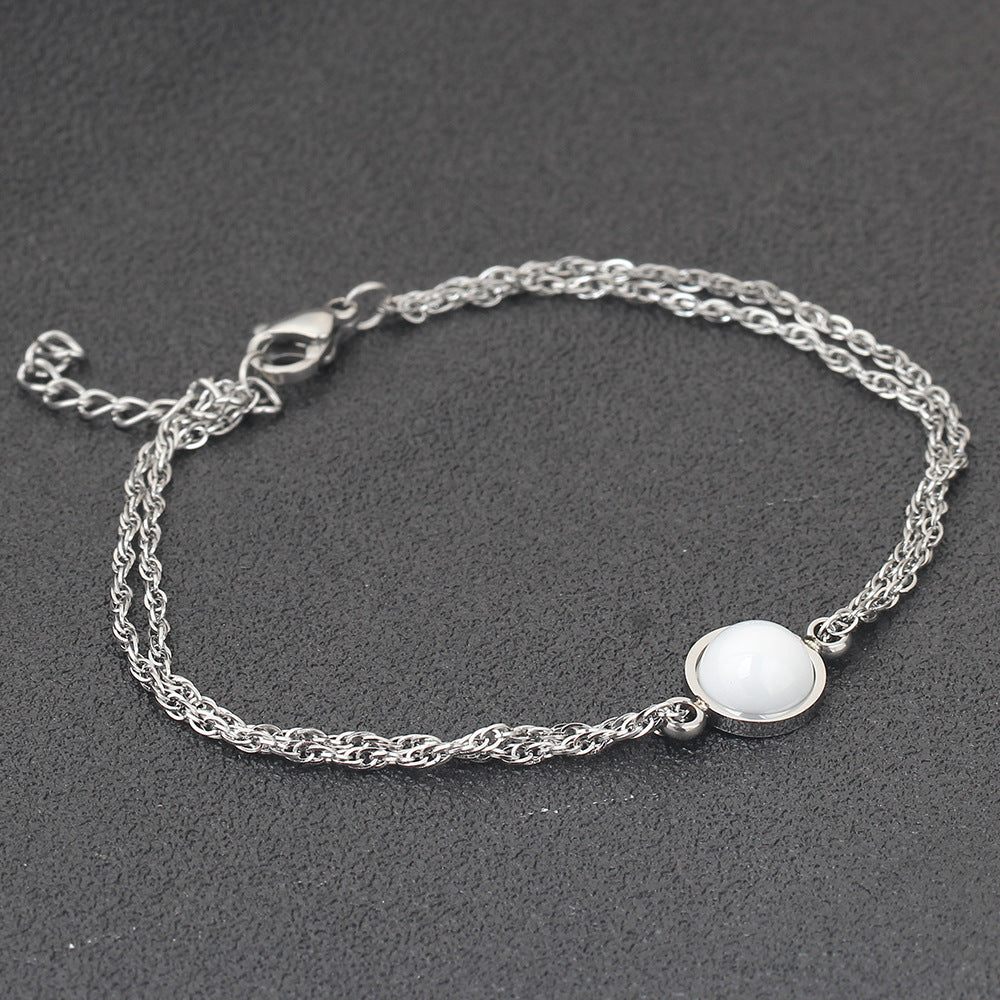 Damen Armband mit funkelndem Zirkonia und hochwertiger Edelstahlkette Shop Nory