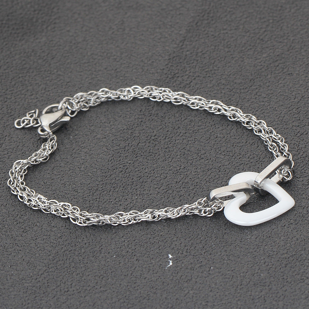 Damen Armband mit eleganter Herzform und doppelter Kettenstruktur Shop Nory