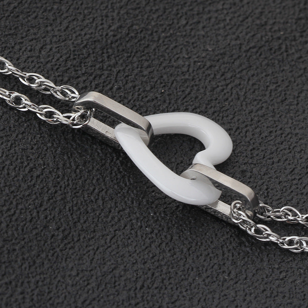 Damen Armband mit eleganter Herzform und doppelter Kettenstruktur Shop Nory