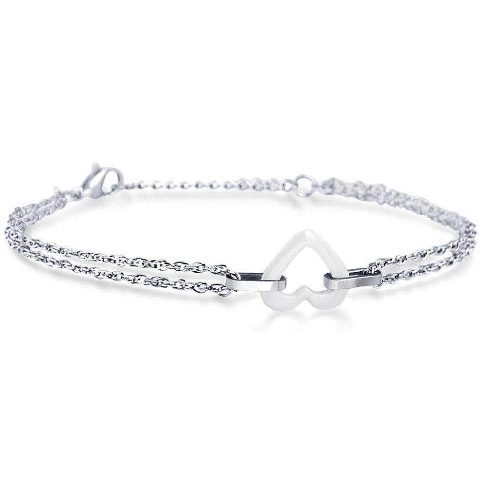 Damen Armband mit eleganter Herzform und doppelter Kettenstruktur Shop Nory