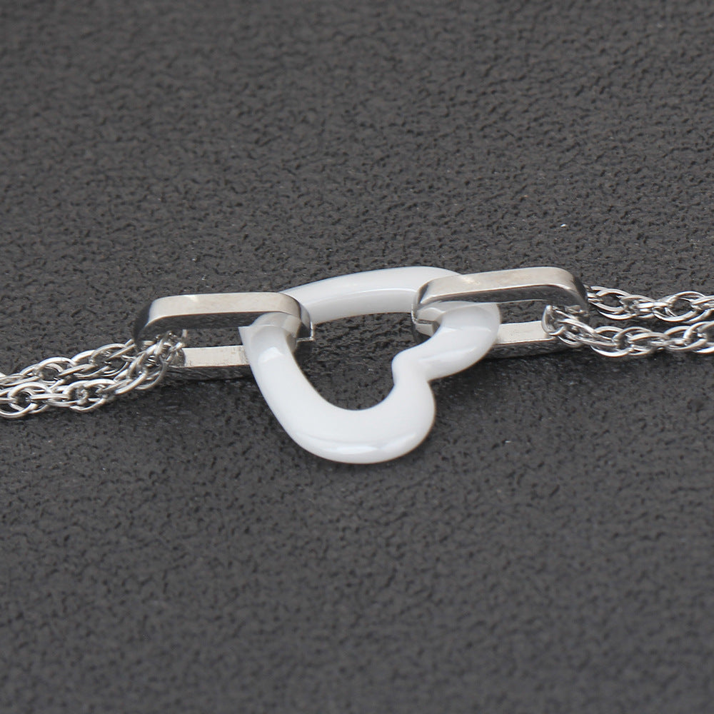 Damen Armband mit eleganter Herzform und doppelter Kettenstruktur Shop Nory