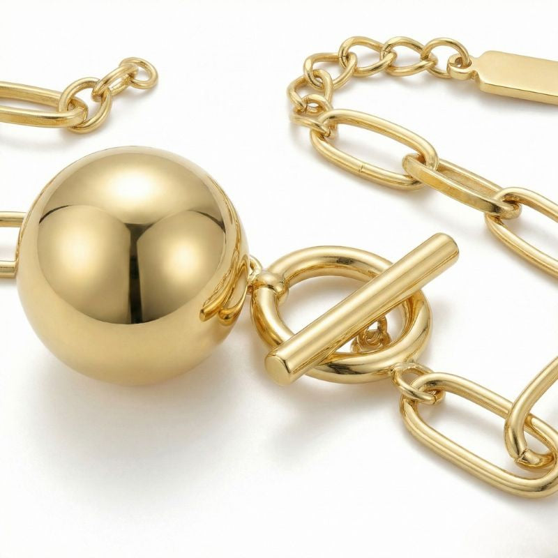 Damen Gliederarmband mit Kugelanhänger in Goldoptik | Shop Nory