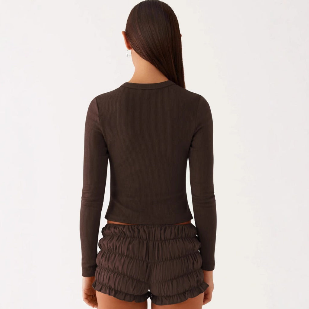 Einfarbige schmal geschnittene lange Strickjacke