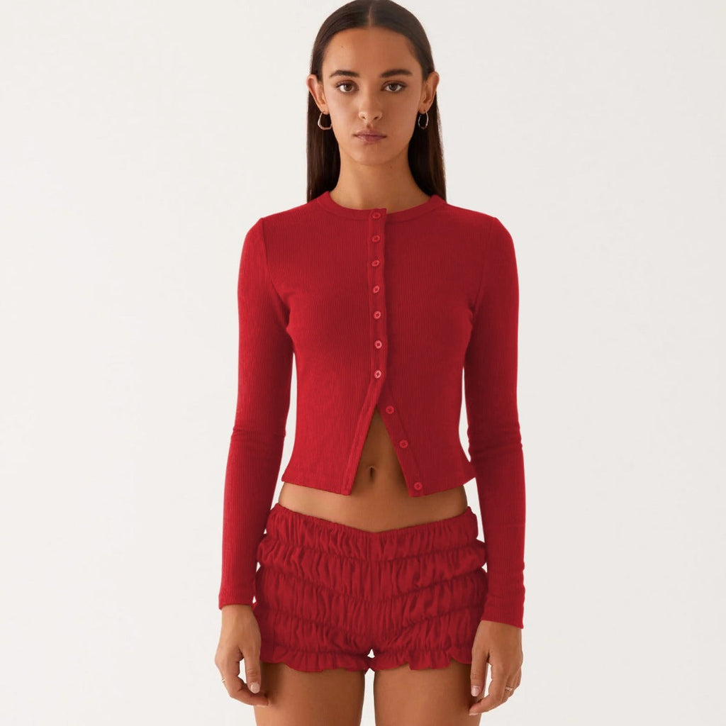 Einfarbige schmal geschnittene lange Strickjacke