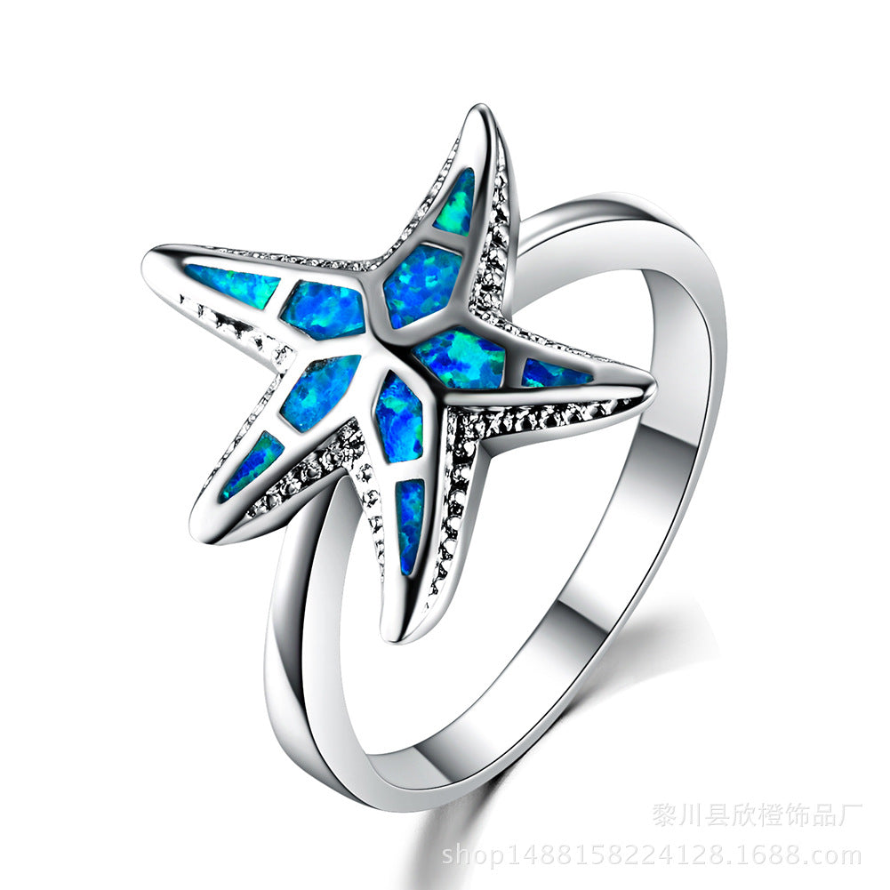 Damen Ring mit kunstvollem See-Stern-Design und schimmernden Opal-Elementen Shop Nory