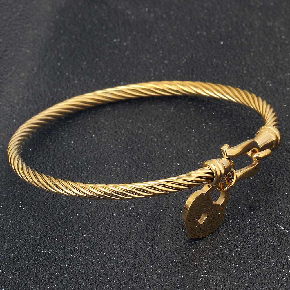 Damen Armreif mit Herzschloss und elegante Zwirnstruktur Shop Nory