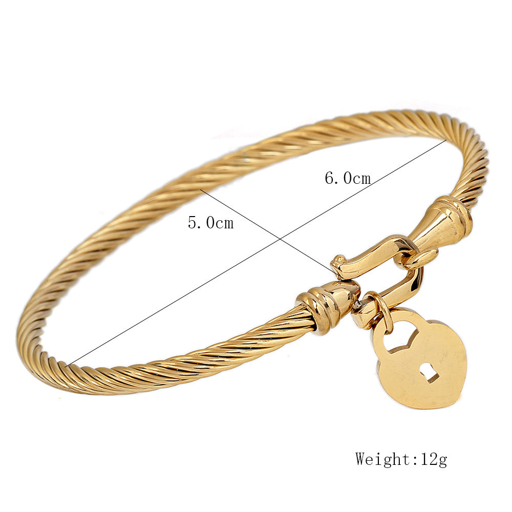 Damen Armreif mit Herzschloss und elegante Zwirnstruktur Shop Nory