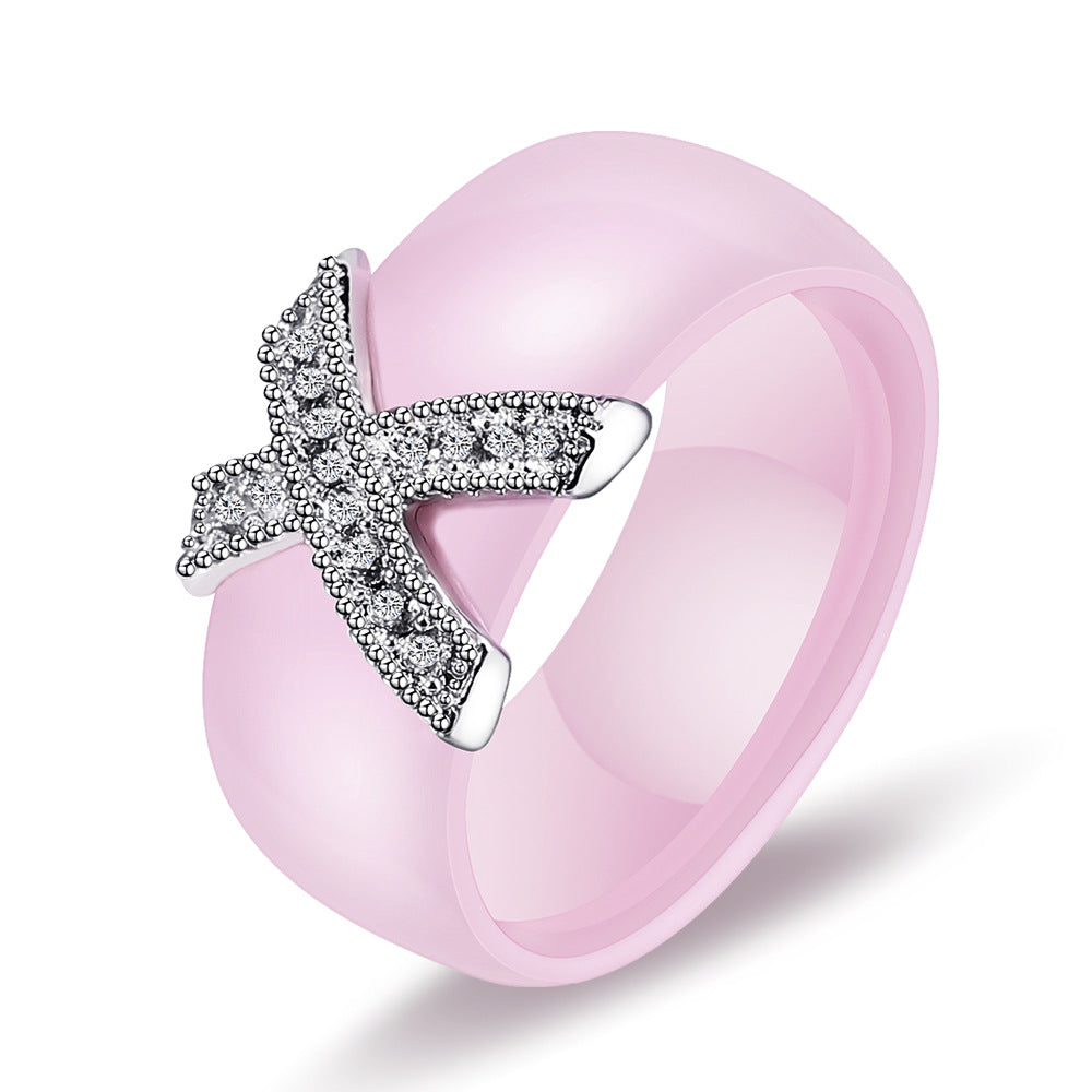 Damen Ring mit funkelndem Kristallbesatz und modernem Kreuzdesign Shop Nory
