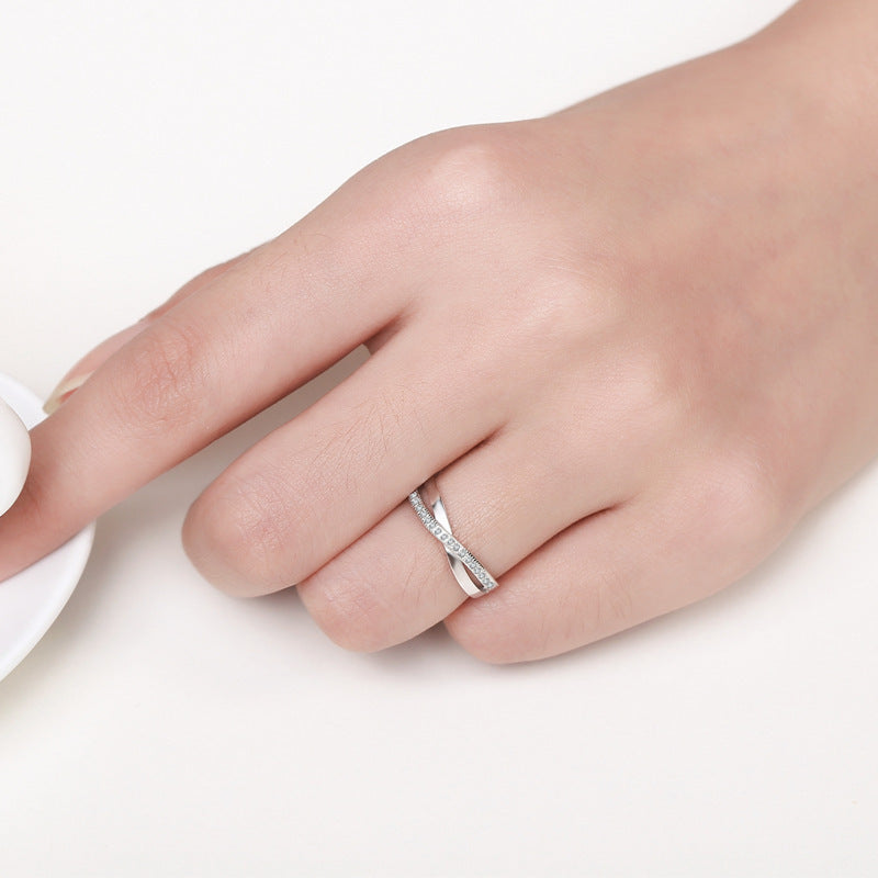 Damenring mit filigraner Zirkonia-Besetzung und elegantem Wellen-Design Shop Nory
