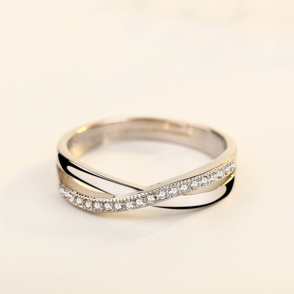 Damenring mit filigraner Zirkonia-Besetzung und elegantem Wellen-Design Shop Nory
