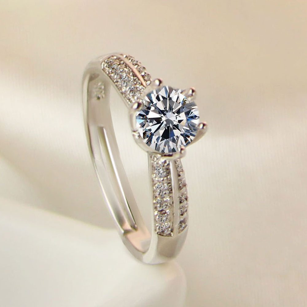 Damen Verlobungsring mit funkelndem Zirkonia-Besatz und eleganter Blumenkopfform Shop Nory