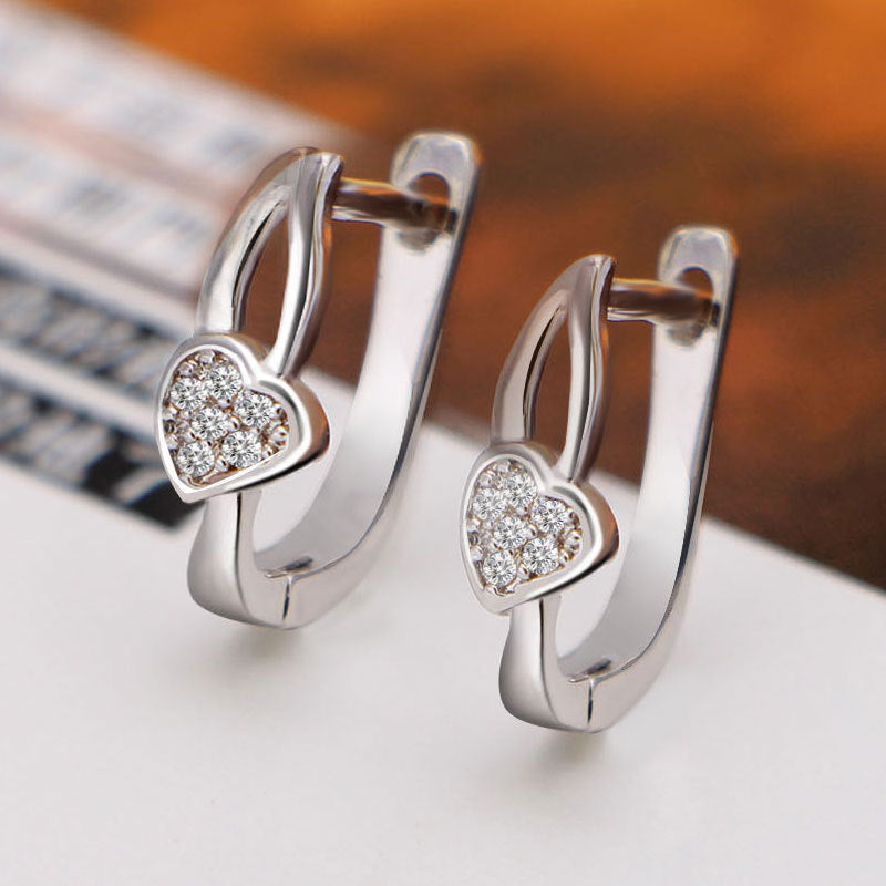 Damen Ohrstecker mit herzförmigem Design und funkelnden Zirkonia-Elementen Shop Nory