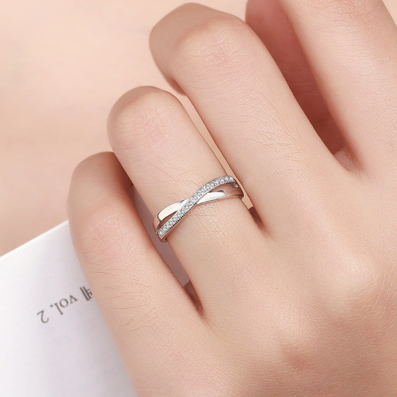 Damenring mit filigraner Zirkonia-Besetzung und elegantem Wellen-Design Shop Nory