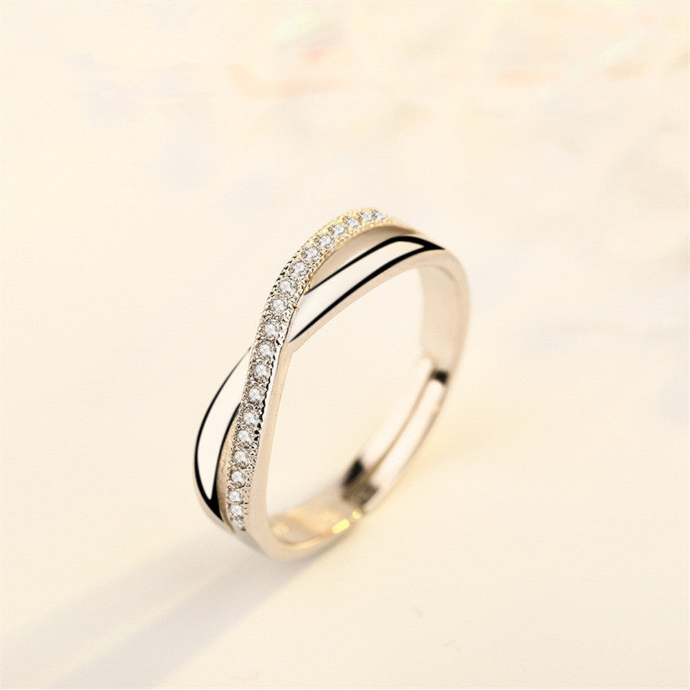 Damenring mit filigraner Zirkonia-Besetzung und elegantem Wellen-Design Shop Nory