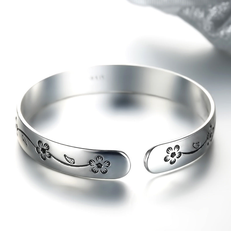 Damenarmreif mit kunstvollem Blumenmotiv aus Edelstahl Shop Nory