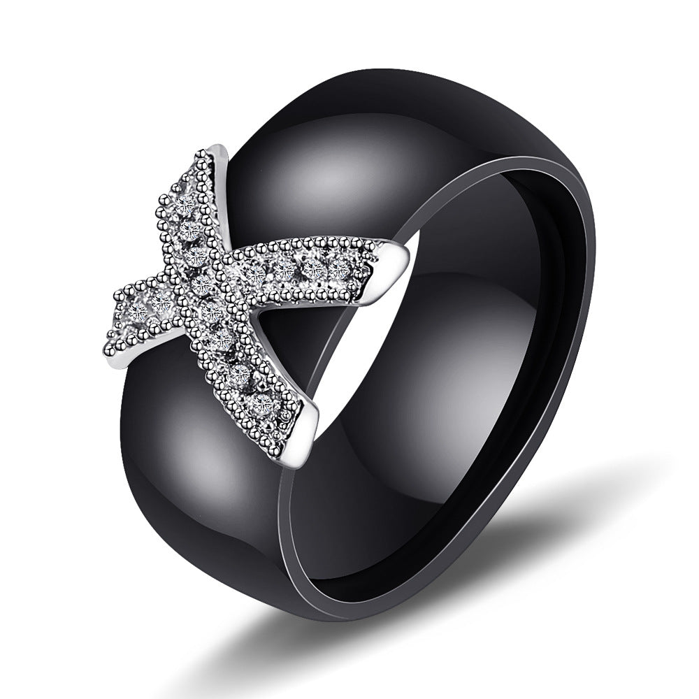 Damen Ring mit funkelndem Kristallbesatz und modernem Kreuzdesign Shop Nory