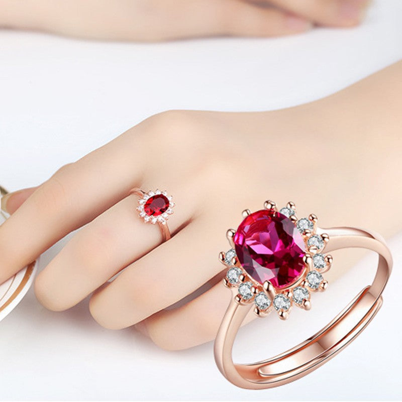 Damenring mit elegantem rotem Hauptstein und funkelndem Zirkonia-Besatz Shop Nory