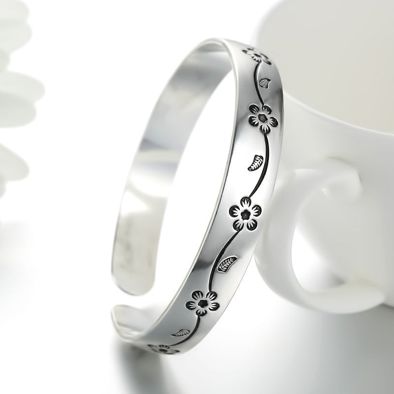 Damenarmreif mit kunstvollem Blumenmotiv aus Edelstahl Shop Nory