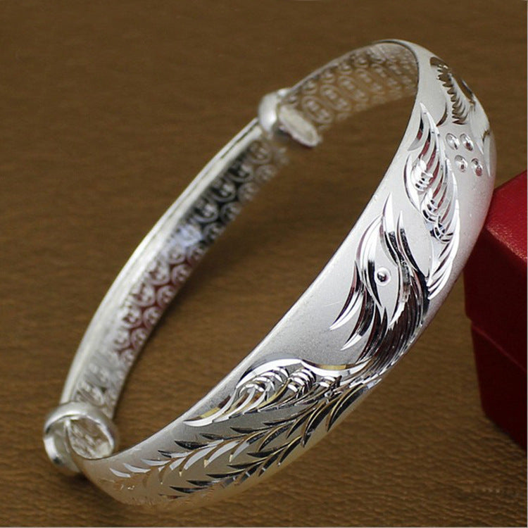 Damen Silberarmband mit kunstvollem Vogelmotiv und feiner Textur Shop Nory