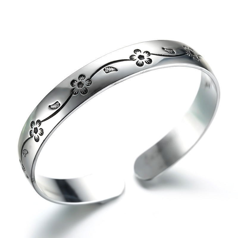 Damenarmreif mit kunstvollem Blumenmotiv aus Edelstahl Shop Nory