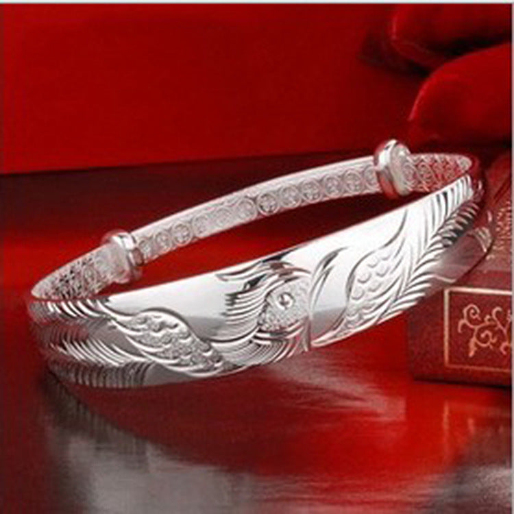 Damen Silberarmband mit kunstvollem Vogelmotiv und feiner Textur Shop Nory