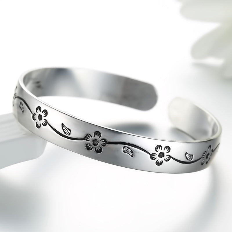 Damenarmreif mit kunstvollem Blumenmotiv aus Edelstahl Shop Nory