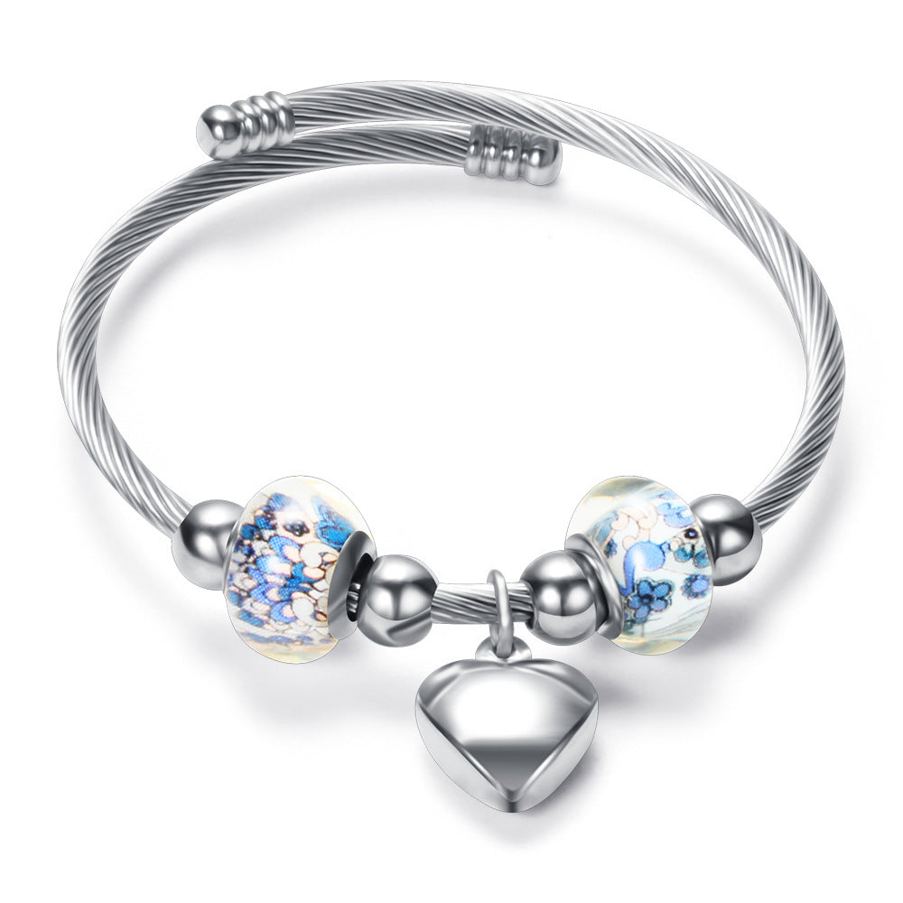 Damen Armband mit zeitlosen Glaskugeln und Herzanhänger Shop Nory