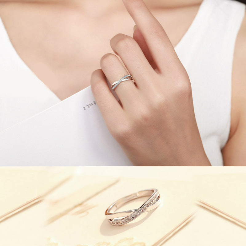 Damenring mit filigraner Zirkonia-Besetzung und elegantem Wellen-Design Shop Nory