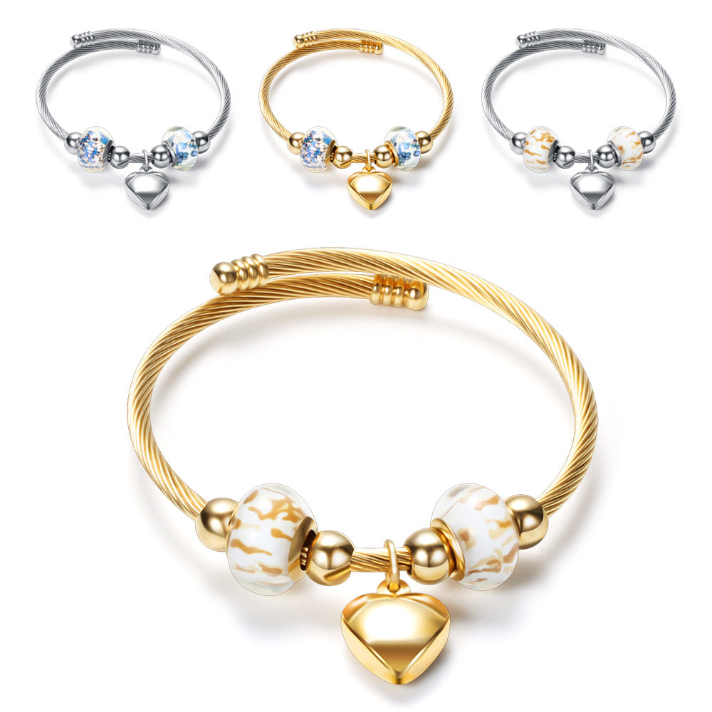 Damen Armband mit zeitlosen Glaskugeln und Herzanhänger Shop Nory