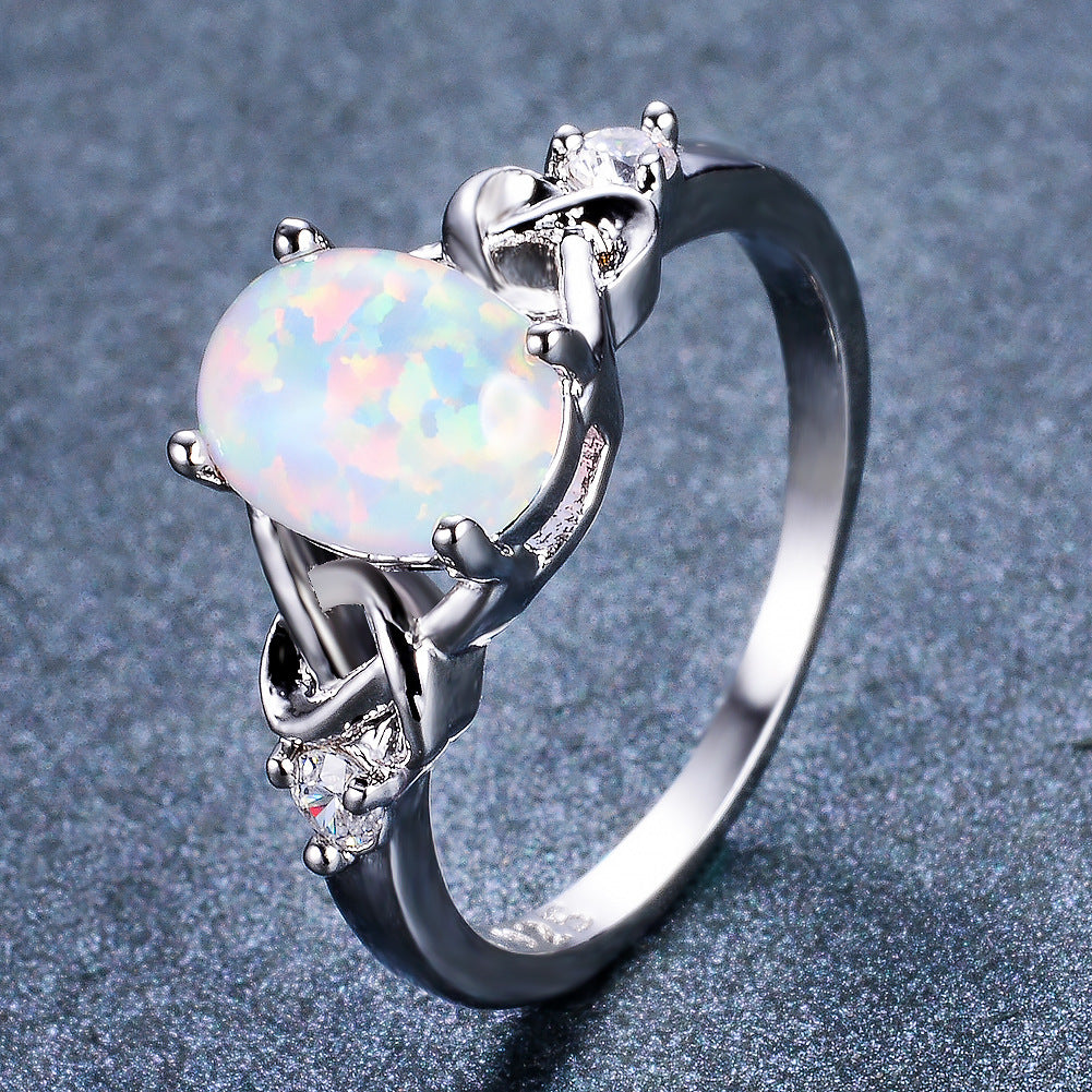 Damen Ring mit funkelndem Opalschmuck und kunstvollen Zirkonia-Details Shop Nory