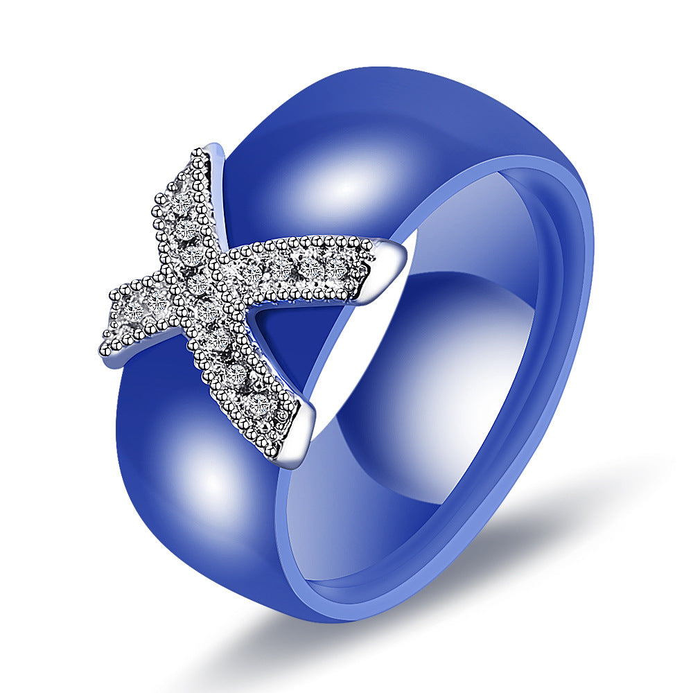 Damen Ring mit funkelndem Kristallbesatz und modernem Kreuzdesign Shop Nory