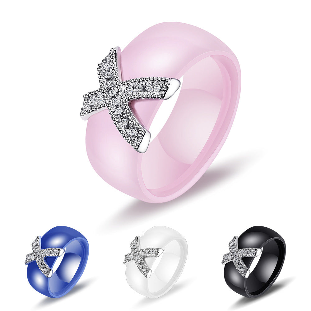 Damen Ring mit funkelndem Kristallbesatz und modernem Kreuzdesign Shop Nory