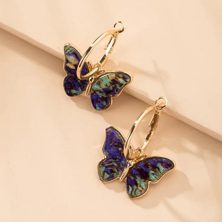 Vergoldete Schmetterlingsohrringe mit Acrylkristallen – Mariposa | Shop Nory