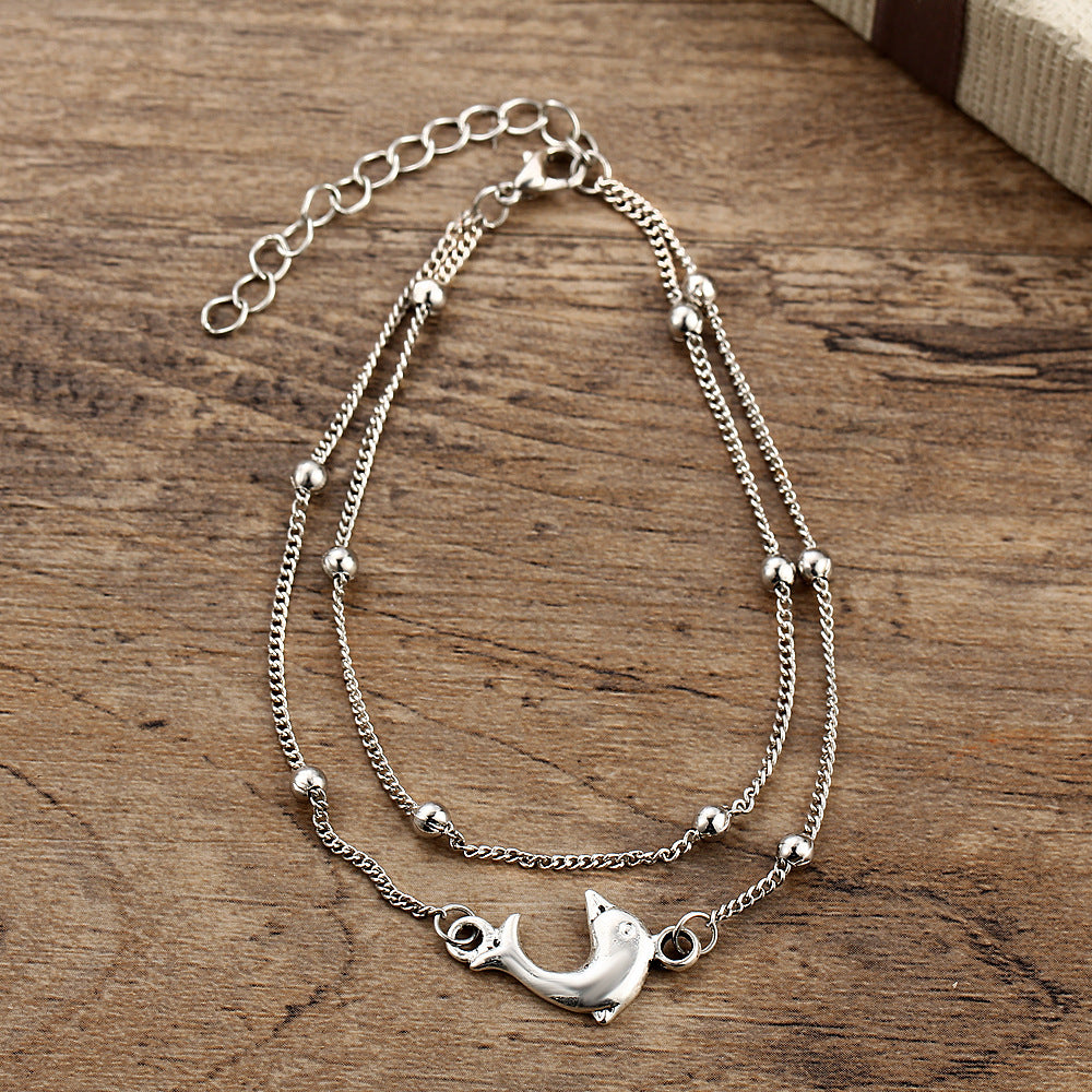 Damenarmband mit verspieltem Delphin-Anhänger Shop Nory